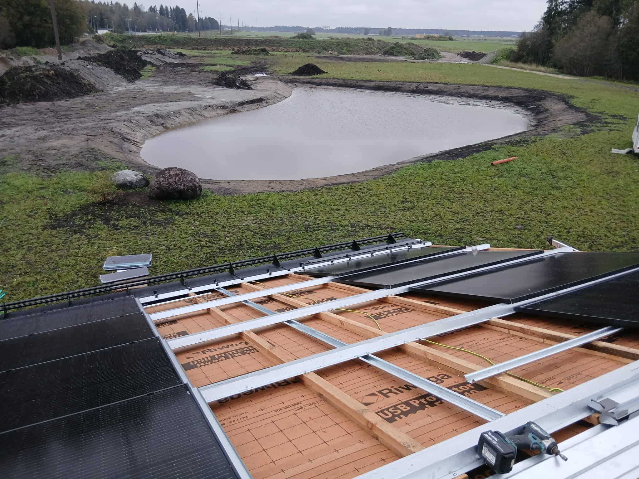 Installation detail showing metal framework and wooden underlayment